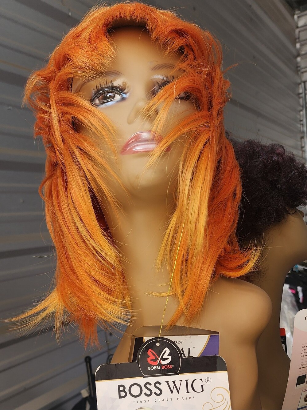 Bobbi Boss Women's Short Layered Wig in CoppOrange
